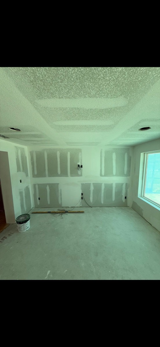 Room with fresh drywall ready for paint