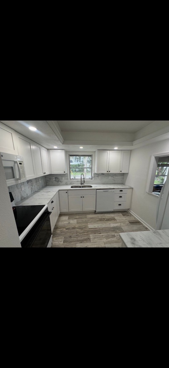 Finished kitchen remodel with white cabinets